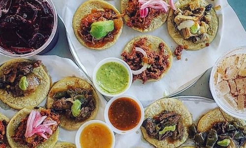 lifestyle image of mexican food and margaritas